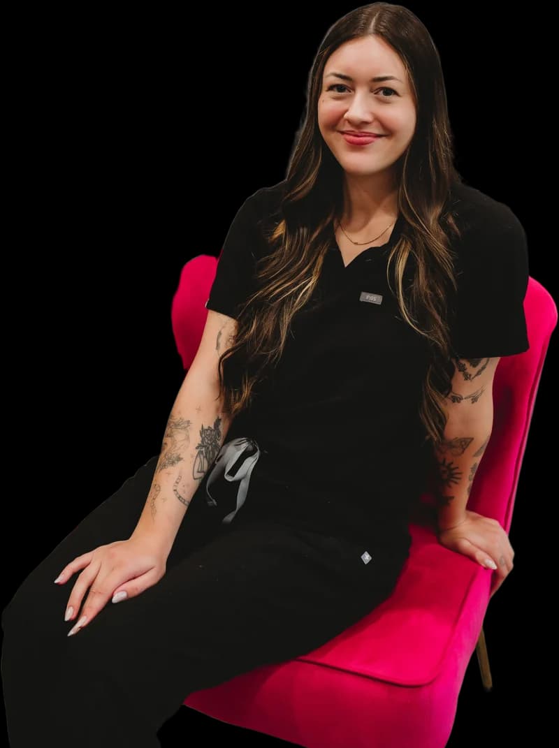 Maggie on the pink velvet chair at Just Face It