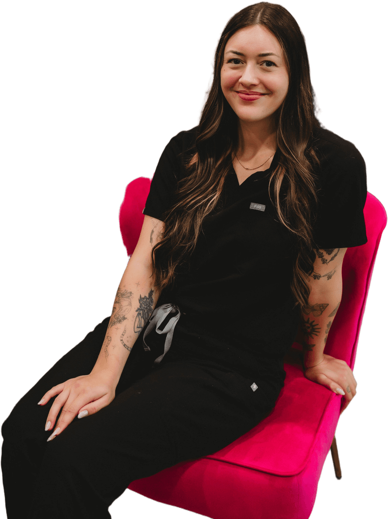 Maggie, esthetician, on the hot pink velvet chair