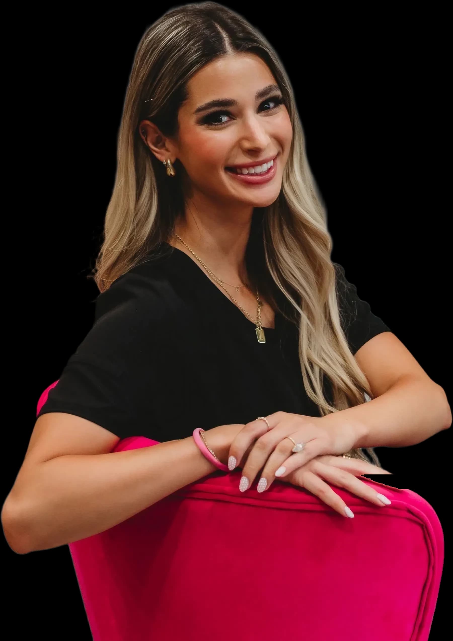 Grace, RN, sitting on the hot pink velvet chair, smiling