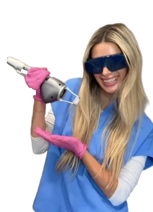 Grace holding the NouvaDerm laser handpiece, wearing her laser goggles